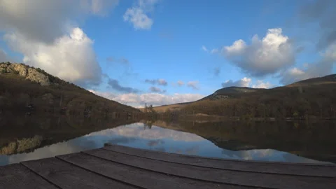 Time lapse on the lake with beautiful clouds on an autumn day Stock Footage 98154149