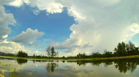 Time lapse of lake with clouds running through the sky in Thailand. Stock Footage 40280069