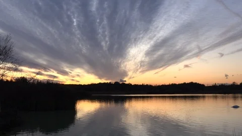 Time lapse of lake in evening light sunset UK 4K Video stock 119627192