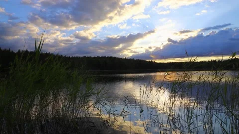 Time lapse of lake scenery with clouds gathering rapidly in sunset. Stock Footage 208638072