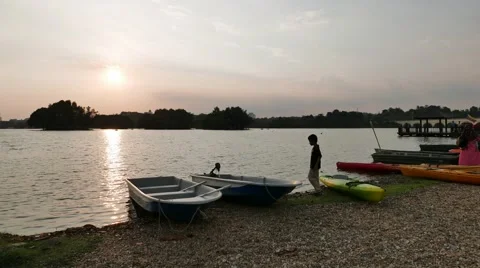 Time lapse lake side activity at sunset moment Stock Footage 61325652