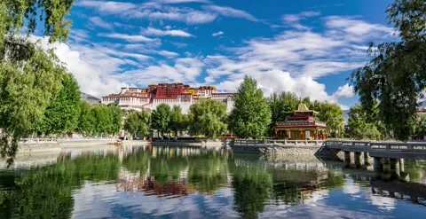 Time Lapse of Lake Surrounded Green Trees All Day Flowing Cloud Potala Palace Stock Footage 337944997