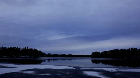 Time Lapse: Lake Turns Indigo at Dusk Stock Footage 12661355