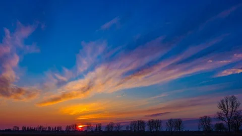 Time lapse landscape of after sunset colorful sky over early spring field in Pol Stock Footage 88458197