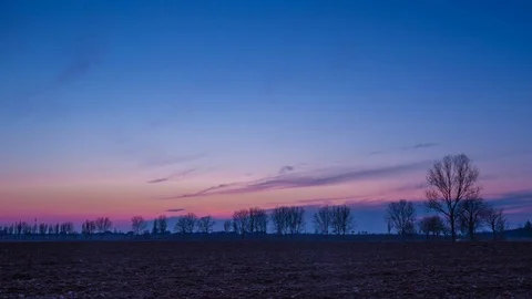 Time lapse landscape of after sunset colorful sky over field Stock Footage 88520134