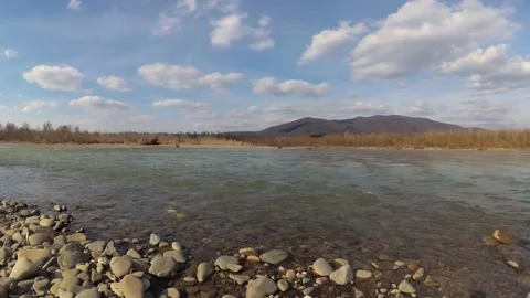 Time lapse of a landscape with a full-flowing spring mountain river Stock Footage