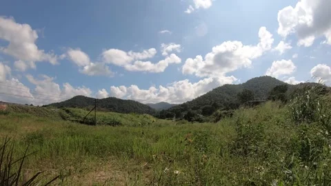 Time lapse landscape moving clouds and golf course Stock Footage 142682651