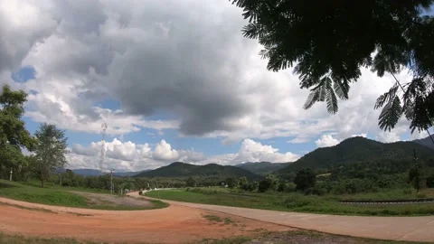 Time lapse landscape moving clouds and golf course Stock Footage 142682752