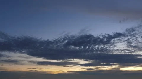 Time-lapse landscape , red purple blue yellow pink clouds are moving fast in the Stockbeeldmateriaal 131130574