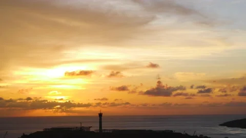Time-lapse landscape , red purple blue yellow pink clouds are moving fast in the Stock Footage 131130677
