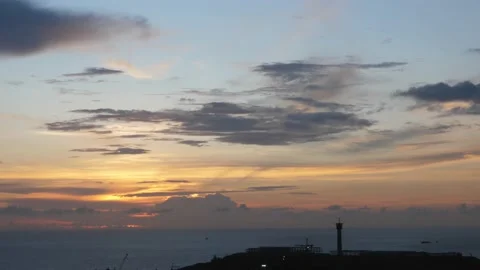 Time-lapse landscape , red purple blue yellow pink clouds are moving fast in the Stock Footage 131130705