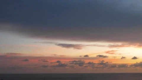 Time-lapse landscape , red purple blue yellow pink clouds are moving fast in the Stockbeeldmateriaal 131130833