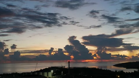 Time-lapse landscape , red purple blue yellow pink clouds are moving fast in the Stockbeeldmateriaal 131131068