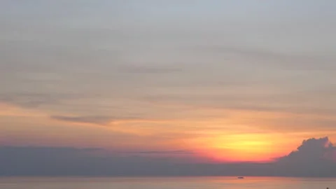 Time-lapse landscape , red purple blue yellow pink clouds are moving fast in the Stockbeeldmateriaal 131131301
