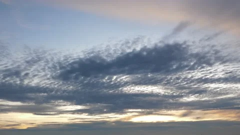 Time-lapse landscape , red purple blue yellow pink clouds are moving fast in the 動画素材 131131349