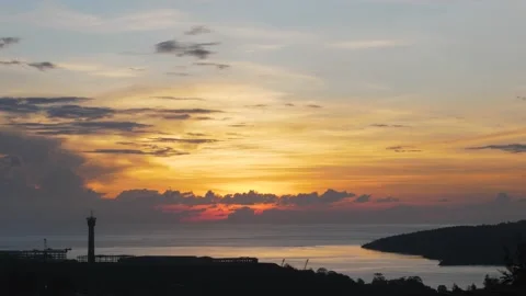 Time-lapse landscape , red purple blue yellow pink clouds are moving fast in the Stockbeeldmateriaal 131131759