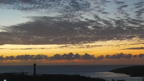 Time-lapse landscape , red purple blue yellow pink clouds are moving fast in the Stockbeeldmateriaal 131131802