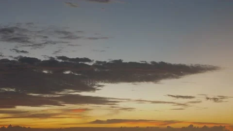 Time-lapse landscape , red purple blue yellow pink clouds are moving fast in the Stock Footage 131132306