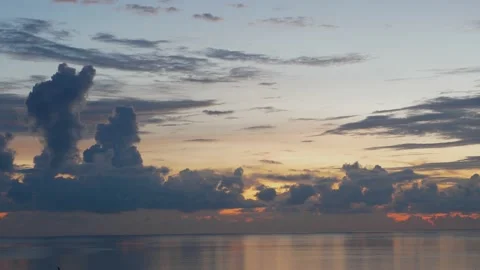 Time-lapse landscape , red purple blue yellow pink clouds are moving fast in the Stockbeeldmateriaal 131132380