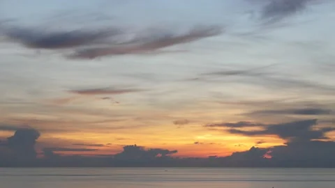 Time-lapse landscape , red purple blue yellow pink clouds are moving fast in the Stockbeeldmateriaal 131132402
