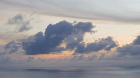 Time-lapse landscape , red purple blue yellow pink clouds are moving fast in the Stockbeeldmateriaal 131132875