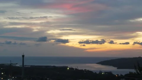 Time-lapse landscape , red purple blue yellow pink clouds are moving fast in the 動画素材 131133072