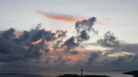 Time-lapse landscape , red purple blue yellow pink clouds are moving fast in the Stock Footage 131133459