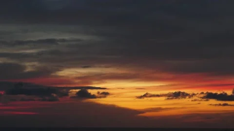 Time-lapse landscape , red purple blue yellow pink clouds are moving fast in the Stockbeeldmateriaal 131133703