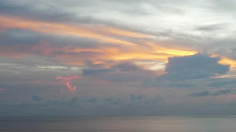 Time-lapse landscape , red purple blue yellow pink clouds are moving fast in the Stock Footage 131133986