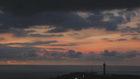 Time-lapse landscape , red purple blue yellow pink clouds are moving fast in the Stockbeeldmateriaal 142248932