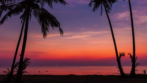Time lapse landscape: sunset on a tropical beach with moving clouds in the sky Stock Footage 73537392