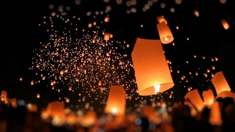 Time-lapse, Lanterns of light into the night sky by multi ethnic crowd. Stock Footage 119019200