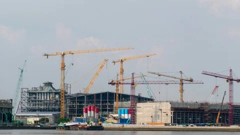 Time-Lapse Large construction By the river with crane work. Stock Footage 104612726