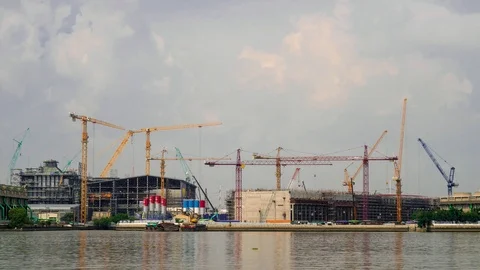Time-Lapse Large construction By the river with crane work. Stock Footage 104612818