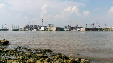 Time-Lapse Large construction By the river with crane work. Stock Footage 104612839