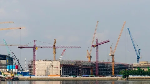 Time-Lapse Large construction By the river with crane work. Stock Footage 104612858