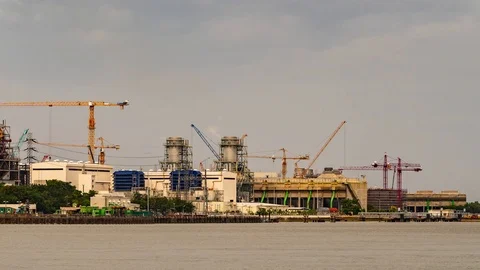 Time-Lapse Large construction By the river with crane work. Stock Footage 104613323