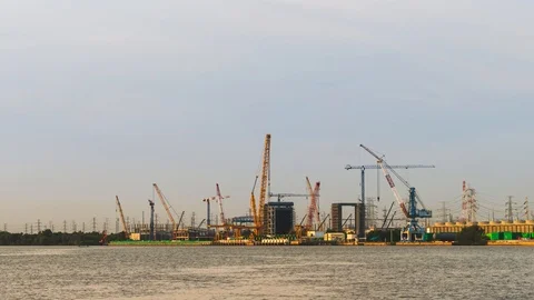 Time Lapse Large construction By the river with crane work. Stock Footage 112336067