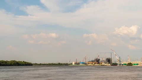Time Lapse Large construction By the river with crane work. Video stock 118968004