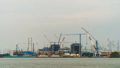 Time Lapse Large construction By the river with crane work. Stock Footage 119219980