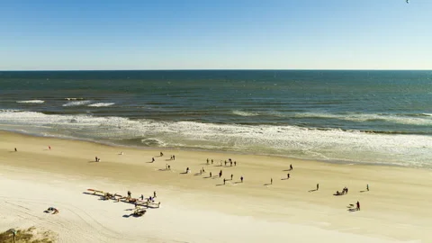 Time lapse of large crowds of people at the beach in Jacksonville, Florida Stock Footage 306072429