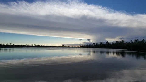 Time lapse of late afternoon cloudscape over Pine Glades Lake in Everglades 4K. Stock Footage 183176508