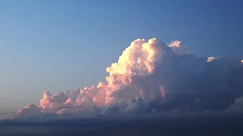 Time lapse of late day storm clouds that are lit by a setting sun.  Stock Footage 281184916