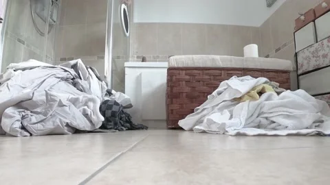 Time lapse of laundry piling up in the bathroom Stock Footage 170503307