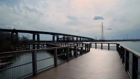 Time-Lapse Laurel Hill Park Fishing Pier and the NJ Turnpike Stock Footage 106356079