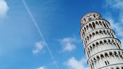 Time Lapse of Leaning Tower Of Pisa. In the cloudy sky you can see a contrail. Stock Footage 123851532