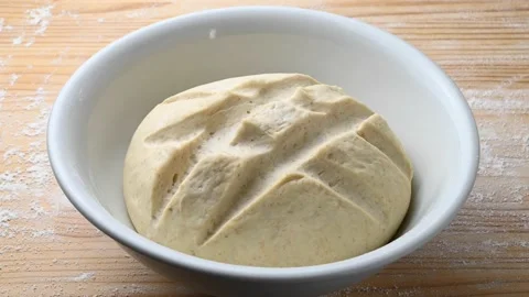 Time lapse leavening of dough for bread or pizza, closeup. Stock Footage 146065642