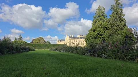 Time lapse of Lednice Castle and garden lawn with moving clouds Wide Shot Stock Footage 347253651