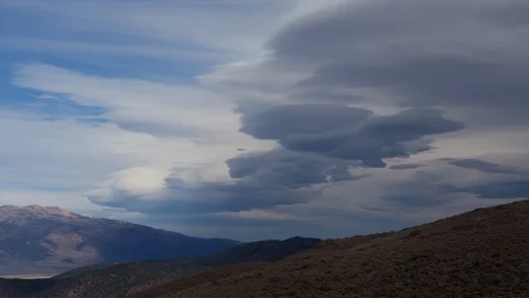 Time lapse of lenticular clouds forming over the Bodie Hills in California Stock Footage 117374977