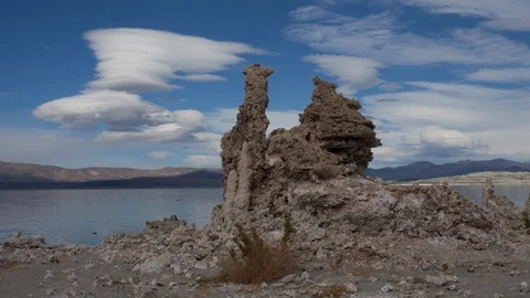 Time lapse of lenticular clouds forming over ancient tufa towers in Mono Lake Stock Footage 119342616